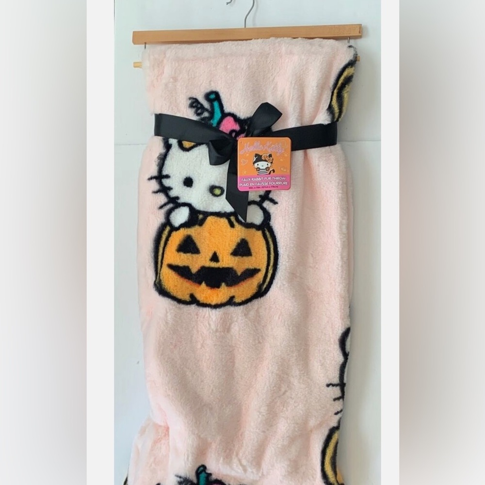 Halloween Hello Kitty throw pumpkins and candy design